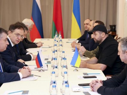 Vladimir Medinsky, the head of the Russian delegation, second left, and Davyd Arakhamia, faction leader of the Servant of the People party in the Ukrainian Parliament, third right, attend the peace talks in Gomel region, Belarus, Monday, Feb. 28, 2022. The Russian and Ukrainian delegations have met for their preliminary …
