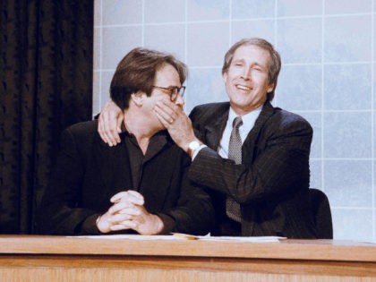 "Saturday Night Live" alumni Dan Aykroyd, left, and Chevy Chase joke during taping of the "Dennis Miller Show," Feb. 28, 1992 in Los Angeles. The two recreated roles they played on the "Weekend Update" section of "Saturday Night Live," a role Dennis Miller took over and played for six years. …
