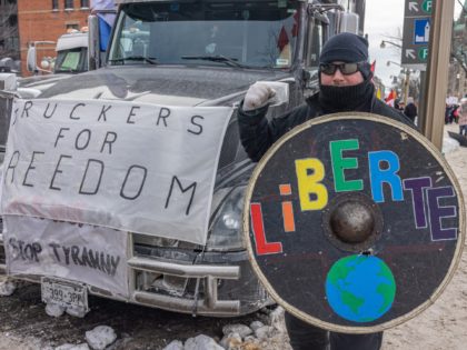 OTTAWA, ON - JANUARY 30: A man shows off his shield during a protest against COVID-19 vaccine mandates on Parliament Hill on January 30, 2022 in Ottawa, Canada. Thousands turned up over the weekend to rally in support of truckers using their vehicles to block access to Parliament Hill, most …