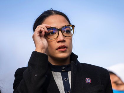 WASHINGTON, DC - DECEMBER 7: Rep. Alexandria Ocasio-Cortez (D-NY) prepares to speak during a rally for immigration provisions to be included in the Build Back Better Act outside the U.S. Capitol December 7, 2021 in Washington, DC. Progressive Democrats are urging the Senate to include a pathway to citizenship for …
