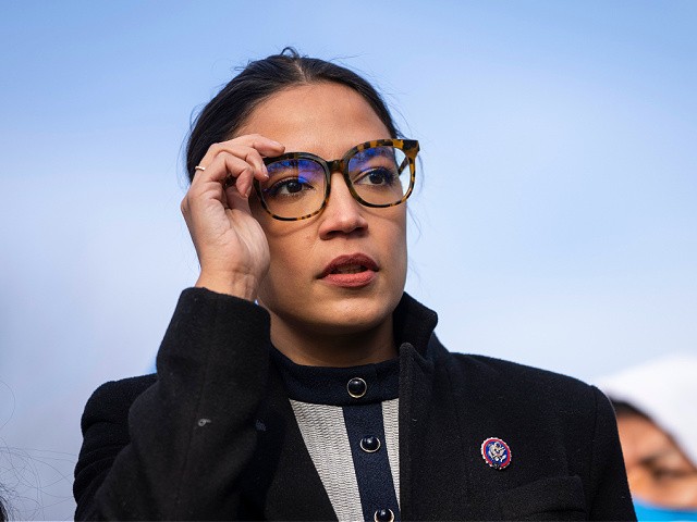 WASHINGTON, DC - DECEMBER 7: Rep. Alexandria Ocasio-Cortez (D-NY) prepares to speak during a rally for immigration provisions to be included in the Build Back Better Act outside the U.S. Capitol December 7, 2021 in Washington, DC. Progressive Democrats are urging the Senate to include a pathway to citizenship for undocumented immigrants living in the U.S. in the Build Back Better Act. (Photo by Drew Angerer/Getty Images)