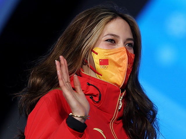 BEIJING, CHINA - FEBRUARY 08: Gold medallist Ailing Eileen Gu of Team China waves during the Women's Freestyle Skiing Freeski Big Air medal ceremony on Day 4 of the Beijing 2022 Winter Olympic Games at Beijing Medal Plaza on February 08, 2022 in Beijing, China. (Photo by Richard Heathcote/Getty Images)