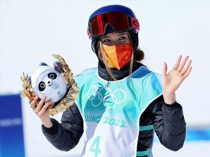 BEIJING, CHINA - FEBRUARY 08: Gold medallist Ailing Eileen Gu of Team China celebrates during the Women's Freestyle Skiing Freeski Big Air flower ceremony on Day 4 of the Beijing 2022 Winter Olympic Games at Big Air Shougang on February 08, 2022 in Beijing, China. (Photo by Lintao Zhang/Getty Images)