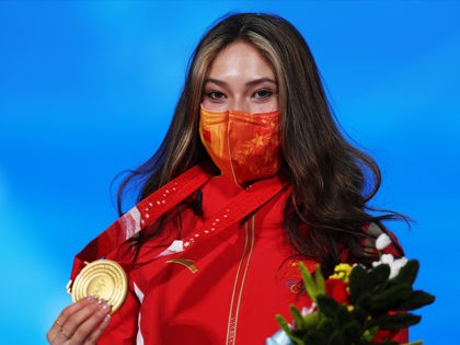 BEIJING, CHINA - FEBRUARY 08: Gold medallist Ailing Eileen Gu of Team China celebrates with their medal during the Women's Freestyle Skiing Freeski Big Air medal ceremony on Day 4 of the Beijing 2022 Winter Olympic Games at Beijing Medal Plaza on February 08, 2022 in Beijing, China. (Photo by …