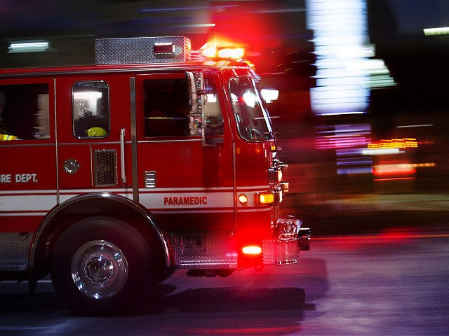 A fire engine races to the scene of an emergency.