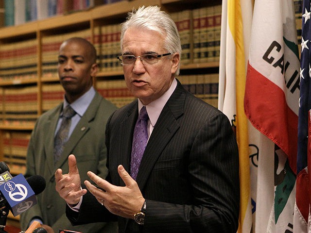 San Francisco District Attorney George Gascon, right, speaks at a news conference with Paul Henderson of the San Francisco Mayor's office Tuesday, June 28, 2011, in San Francisco. Nearly 18 years after a gunman stormed San Francisco's 101 California office tower and opened fire, killing eight people and himself, city …