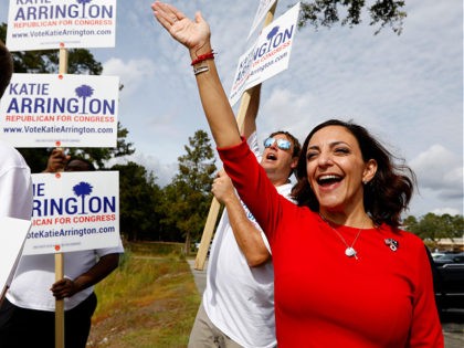 Republican nominee for Congress Katie Arrington waves to voters with other supporters at Westview Primary Schools in Goose Creek, S.C., Tuesday, November, 6, 2018. (AP Photo/Mic Smith)