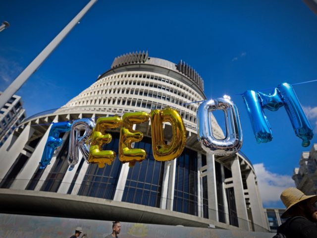 This photo taken on February 15, 2022 shows balloons strung together to read "freedom", in