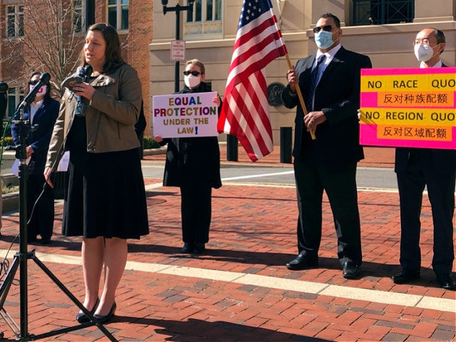 FILE - Pacific Legal Foundation attorney Erin Wilcox speaks at a news conference outside the federal courthouse, Wednesday, March 10, 2021, in Alexandria, Va., where her organization filed a lawsuit against Fairfax County's school board, alleging discrimination against Asian Americans over its revised admissions process for the elite Thomas Jefferson …