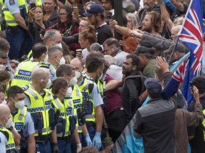 Police arrest people protesting against coronavirus mandates at Parliament in Wellington, New Zealand, Thursday, Feb. 10, 2022. The protest began on Tuesday after more than 1,000 people driving cars and trucks from around the country converged on Parliament in a convoy inspired by protests in Canada and elsewhere around the …