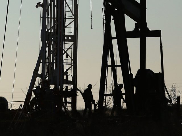 ANDREWS, TX - JANUARY 20: Workers for an oilfield service company work at a drilling site