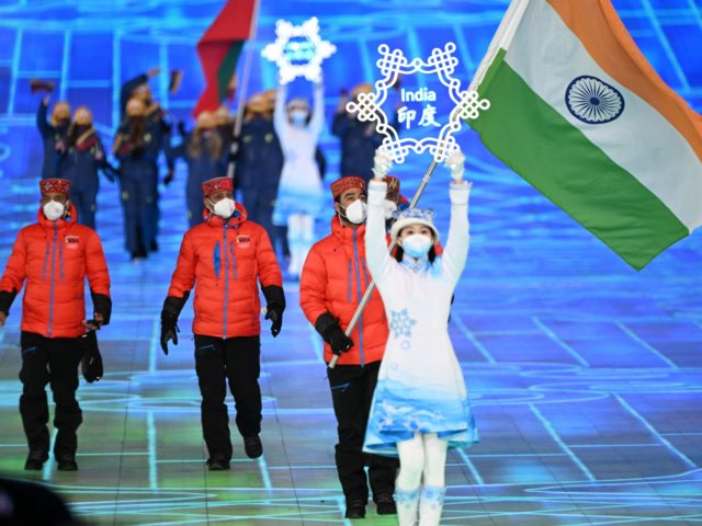 India's flag bearer Arif Mohd Khan parades during the opening ceremony of the Beijing 2022 Winter Olympic Games, at the National Stadium, known as the Bird's Nest, in Beijing, on February 4, 2022. (Photo by Manan VATSYAYANA / AFP) (Photo by MANAN VATSYAYANA/AFP via Getty Images)