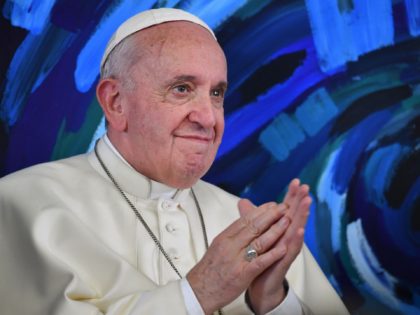 Pope Francis applauds during a global live video conference with students and computer scientists at the headquarters of the Pontifical Foundation for Education "Scholas Occurrentes" in Rome on March 21, 2019, within the launch of the international computer science peace project "Planning for Peace". (Photo by Andreas SOLARO / POOL …