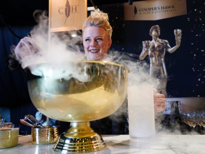 Emily Wines, head sommelier for Cooper's Hawk Winery makes a "froze'" drink from rose' wine, grapefruit liqueur, aperol and grapefruit juice at the 28th Screen Actors Guild Awards Media Preview Day, Thursday, Feb. 24, 2022, at Barker Hangar in Santa Monica, Calif. The SAG Awards will be held on Sunday. …