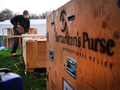 NEW YORK, NEW YORK - MARCH 30: Members of the international Christian humanitarian organization Samaritans's Purse, put the finishing touches on a field hospital in New York's Central Park on March 30, 2020 in New York City. The group, which is led by Franklin Graham, has deployed to help combat …
