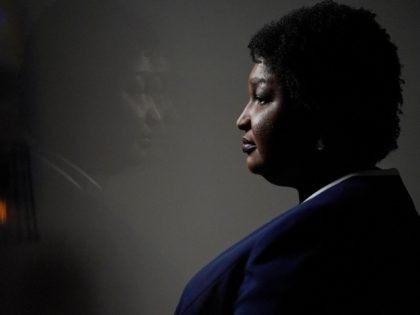 Georgia gubernatorial Democratic candidate Stacey Abrams speaks during an interview with The Associated Press on Thursday, Dec. 16, 2021, in Decatur, Ga. Abrams is calling on Congress to act on voting rights as the Democrat launches a second bid to become her state's governor. (AP Photo/Brynn Anderson)