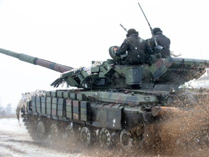 Ukrainian Military Forces servicemen of the 92nd mechanized brigade use tanks, self-propelled guns and other armored vehicles to conduct live-fire exercises near the town of Chuguev, in Kharkiv region, on February 10, 2022. - Russia's deployment for a military exercise in Belarus and on the borders of Ukraine marks a …