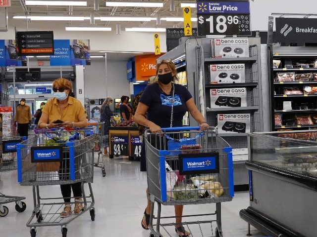 HALLANDALE BEACH, FLORIDA - MAY 18: People wearing protective masks shop in a Walmart stor