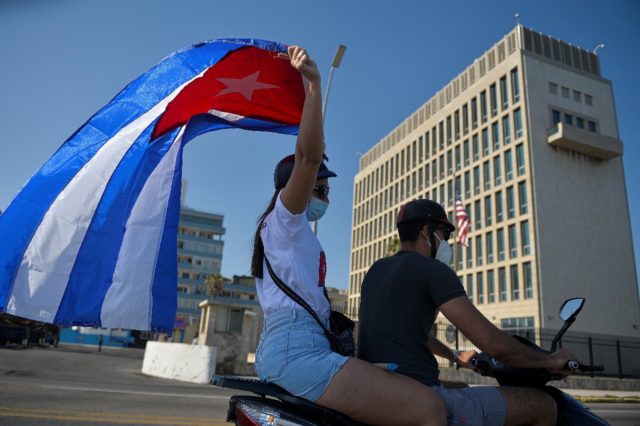 Cuban protesters drive past the US embassy in Havana in March 2021 -- the so-called "Havan