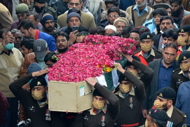 Soldiers carry the coffin of an officer killed in the Balochistan attacks for burial in Fa
