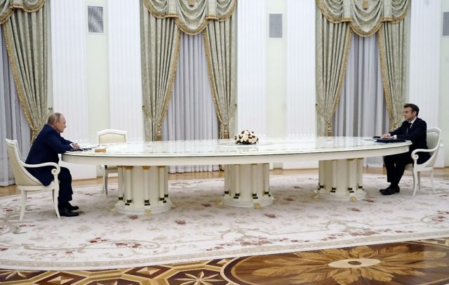 The leaders sat at opposite ends of an unusually long table in the Kremlin on Monday when the French leader came to Moscow to talk about the Ukraine crisis