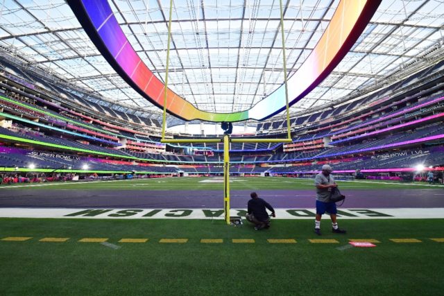 Workers put the finishing touches to the $5 billion SoFi Stadium which will host Sunday's