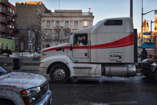 A truck departs a protest by truck drivers over pandemic health rules and the Trudeau gove