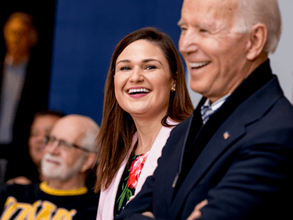 In this Friday, Jan. 3 2020 file photo, Democratic presidential candidate Joe Biden, right, and Rep. Abby Finkenauer, D-Iowa, center, smile during a campaign rally at the University of Dubuque, in Dubuque, Iowa. Iowa Democrat Abby Finkenauer is running for Republican Chuck Grassley’s U.S. Senate seat. The one-term former congresswoman …