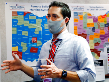 In this Nov. 3, 2020, file photo Ohio Secretary of State Frank LaRose interacts with staff members as they follow the election from Ohio's election command center in Columbus, Ohio. (AP Photo/Jay LaPrete, File)