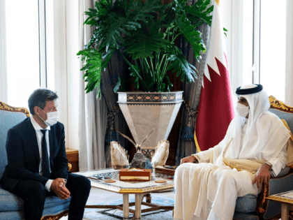 In this photo released by the Qatar Amiri Diwan, German Economy and Climate Minister and Vice Chancellor Robert Habeck, left, meets with the Emir of Qatar Sheikh Tamim bin Hamad Al Thani, in Doha, Qatar, Sunday, March 20, 2022. (Amiri Diwan via AP)