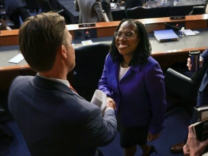 U.S. Supreme Court nominee Judge Ketanji Brown Jackson shakes hands with Sen. Ben Sasse (R-NE) during her confirmation hearing before the Senate Judiciary Committee in the Hart Senate Office Building on Capitol Hill March 21, 2022 in Washington, DC. Judge Ketanji Brown Jackson, President Joe Biden's pick to replace retiring …