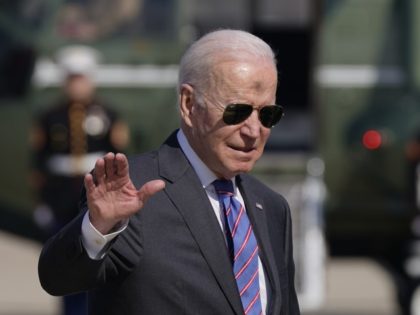 President Joe Biden waves as he and first lady Jill Biden board Air Force One, Wednesday, March 2, 2022, at Andrews Air Force Base, Md. Biden is en route to Superior, WI, to promote his infrastructure agenda.