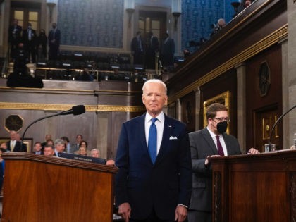 President Joe Biden arrives to deliver his first State of the Union address to a joint session of Congress at the Capitol, as Vice President Kamala Harris and House Speaker Nancy Pelosi of Calif., applaud, Tuesday, March 1, 2022, in Washington. (Saul Loeb/Pool via AP)