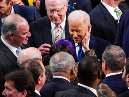 President Joe Biden is greeted by Democrats after delivering his State of the Union address to a joint session of Congress, Tuesday, March 1, 2022, at the Capitol in Washington. (Jabin Botsford, Pool via AP)