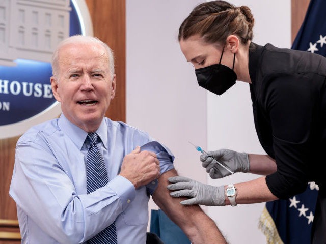 U.S. President Joe Biden answers a reporter's question before receiving a fourth dose of the Pfizer/BioNTech Covid-19 vaccine in the South Court Auditorium on March 30, 2022 in Washington, DC. Before receiving his second booster shot President Biden gave remarks calling on Congress to pass further legislation to provide more …