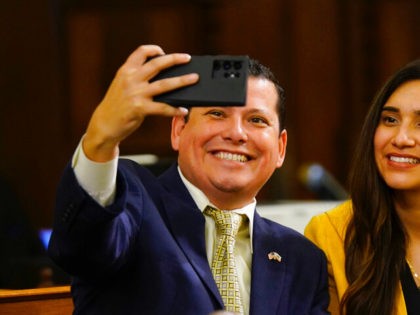 Democratic Assembly members Rudy Salas Jr., of Bakersfield, and Sabrina Cervantes, of Riverside, pose for a selfie at the Capitol in Sacramento, Calif., Monday, March 7, 2022. Salas Jr. is hoping to win a seat in Congress. Because of this year's redistricting, Cervantes will be running for an Assembly seat …