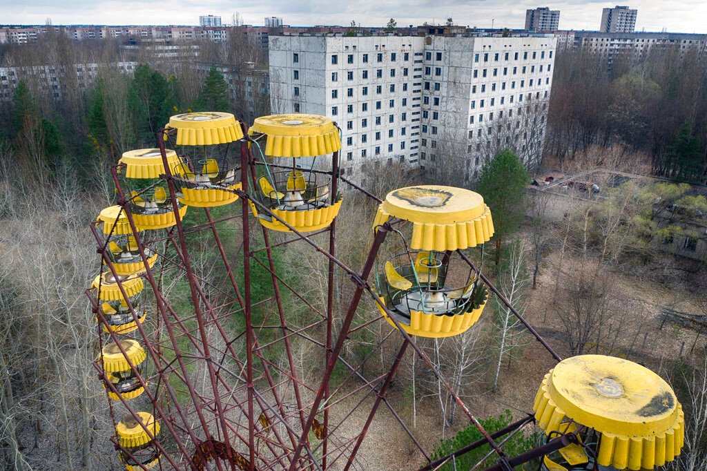 An abandoned Ferris wheel stands in the park in the ghost town of Pripyat, Ukraine, close to the Chernobyl nuclear plant, on April 15, 2021. Among the most worrying developments on an already shocking day, as Russia invaded Ukraine on Thursday, was warfare at the Chernobyl nuclear plant, where radioactivity is still leaking from history's worst nuclear disaster 36 years ago.(AP Photo/Efrem Lukatsky, File)