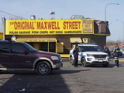 Two Chicago police officers were shot in Lawndale while on break at a hot dog stand. ((Pat Nabong /Chicago Sun-Times via AP)