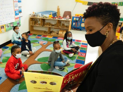 Parent Melissa Jean reads "The Gruffalo" to her son's Pre-K class at Phyl's Academy, Wednesday, March 24, 2021 in the Brooklyn borough of New York. Beginning in September the city's public schools, which currently serve 23,500 three-year-olds, will be adding an additional 16,500 kids to the 3K program. (AP Photo/Mark …