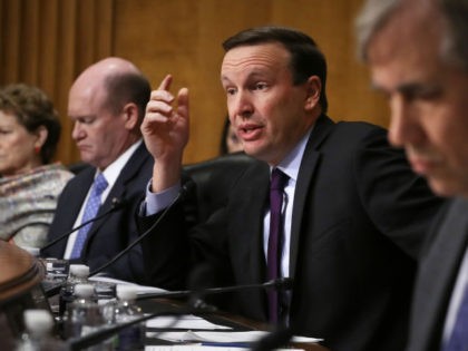Senate Foreign Relations Committee member Sen. Chris Murphy (D-CT) questions witnesses during a hearing about U.S.-Russia relations with fellow members (L-R) Sen. Jeanne Shaheen (D-NH), Sen. Chris Coons (D-DE) and Sen. Jeff Merkley (D-OR) in the Dirksen Senate Office Building on Capitol Hill December 03, 2019 in Washington, DC. (Chip …