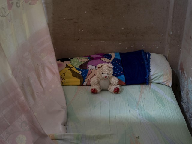 A teddy bear rests on the bed of Mackyanis Yosney Romam Rodriguez who is in prison along with her two brothers, accused of participating in the recent protests against the government, at their home in La Guinera neighborhood of Havana, Cuba, Wednesday, Jan. 19, 2022. Six months after surprising protests against the Cuban government, more than 50 protesters who have been charged with sedition are headed to trial and could face sentences of up to 30 years in prison.