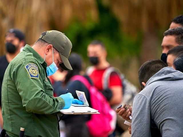 Border Patrol agents process a group of migrants apprehended in March in the Del Rio Sector. (U.S. Border Patrol/Del Rio Sector)