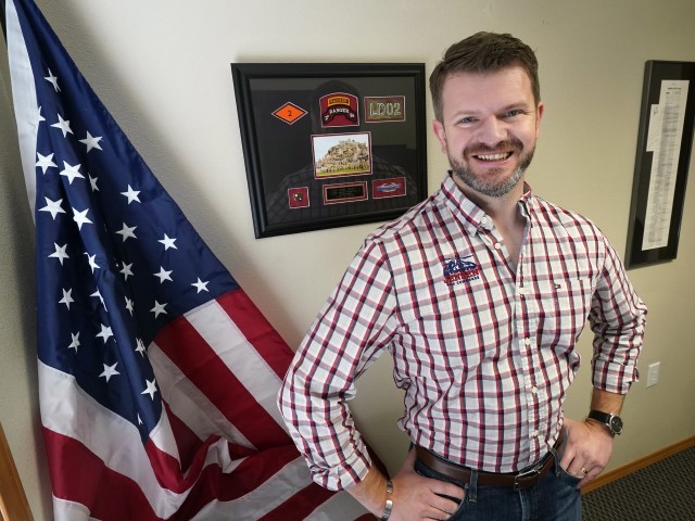 Jesse Jensen, the Republican challenging Rep. Kim Schrier in Washington's 8th Congressional District, poses for a photo in his campaign office Tuesday, Sept. 29, 2020, in Pacific, Wash. Jensen is an Army veteran from Bonney Lake who did four combat tours in Afghanistan.