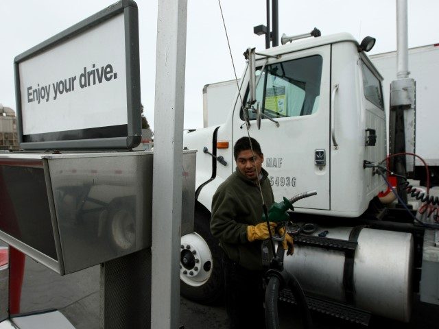SOUTH SAN FRANCISCO, CA - JUNE 23: A truck driver prepares to pump fuel into his truck Jun
