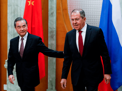 Russian Foreign Minister Sergei Lavrov (R) meets with his Chinese counterpart Wang Yi in S