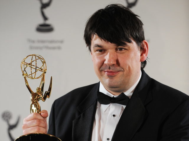 Writer/Director Graham Linehan of Britain holds the award in the Comedy category for "The I.T. Crowd" at the 36th International Emmy Awards November 24, 2008 in New York. AFP PHOTO/Stan HONDA (Photo by STAN HONDA / AFP) (Photo credit should read STAN HONDA/AFP via Getty Images)