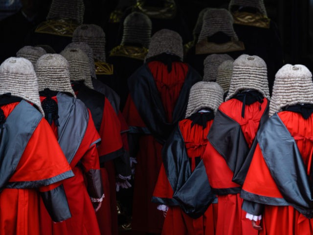 Judges wearing robes and horsehair wigs attend a ceremony to mark the opening of the legal