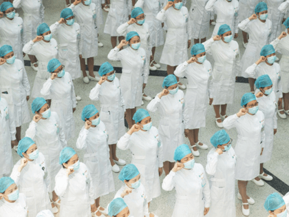 Nurses recite an oath during a ceremony marking International Nurses Day, at Tongji Hospit