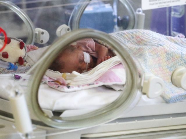 FRIMLEY, ENGLAND - MAY 22: Image released on May 27, A newborn baby in the maternity ward