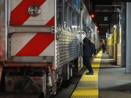 A Metra commuter train conductor works at Union Station on April 28, 2020 in Chicago, Illinois. Union Station serves Amtrak and Metra commuter train passengers riding into downtown Chicago. Amtrak has reported a 95 percent drop in ridership since the start of the COVID-19 pandemic, and Metra a 97 percent …